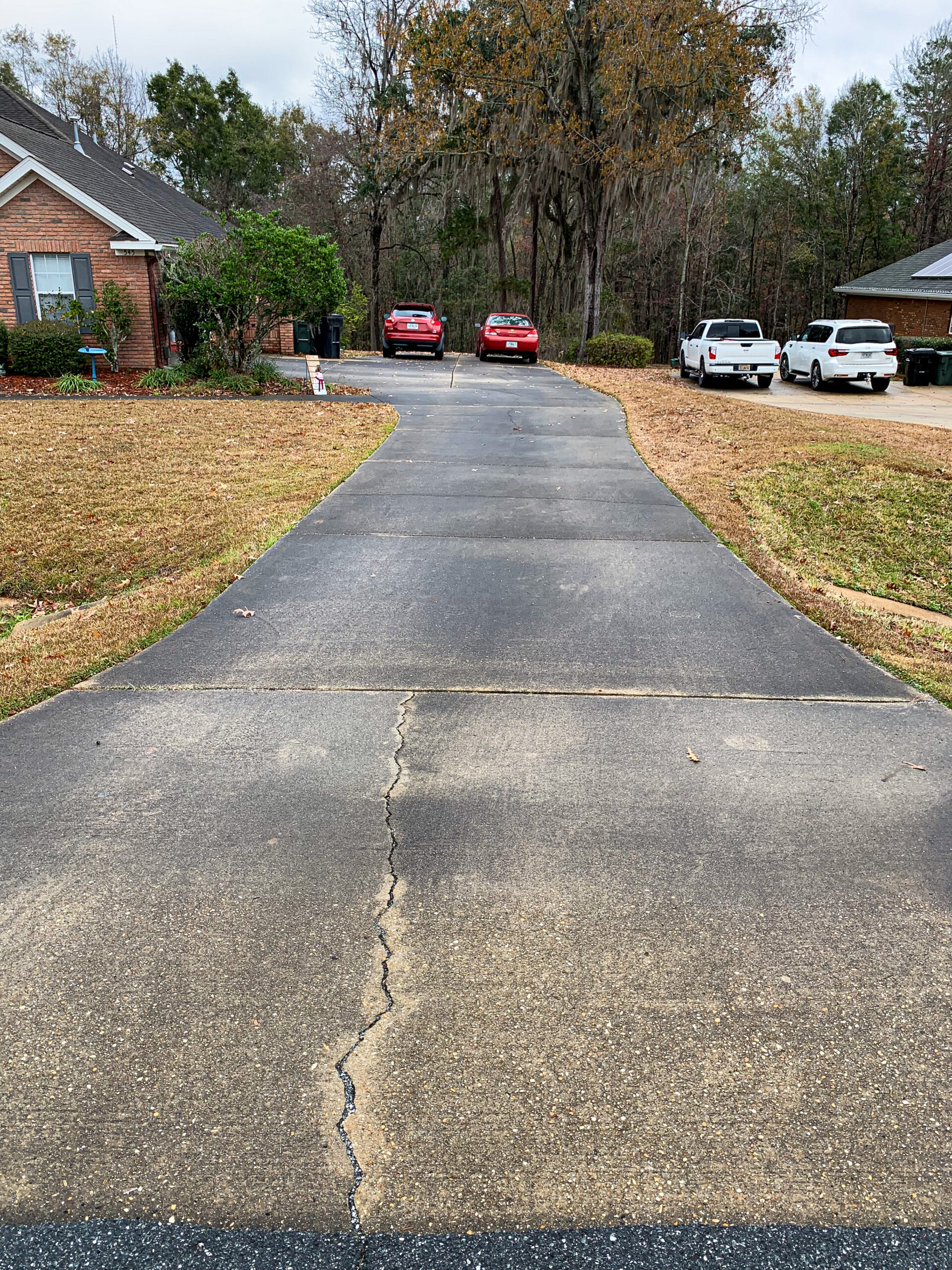 Dirty driveway before professional concrete cleaning in Yorktown VA