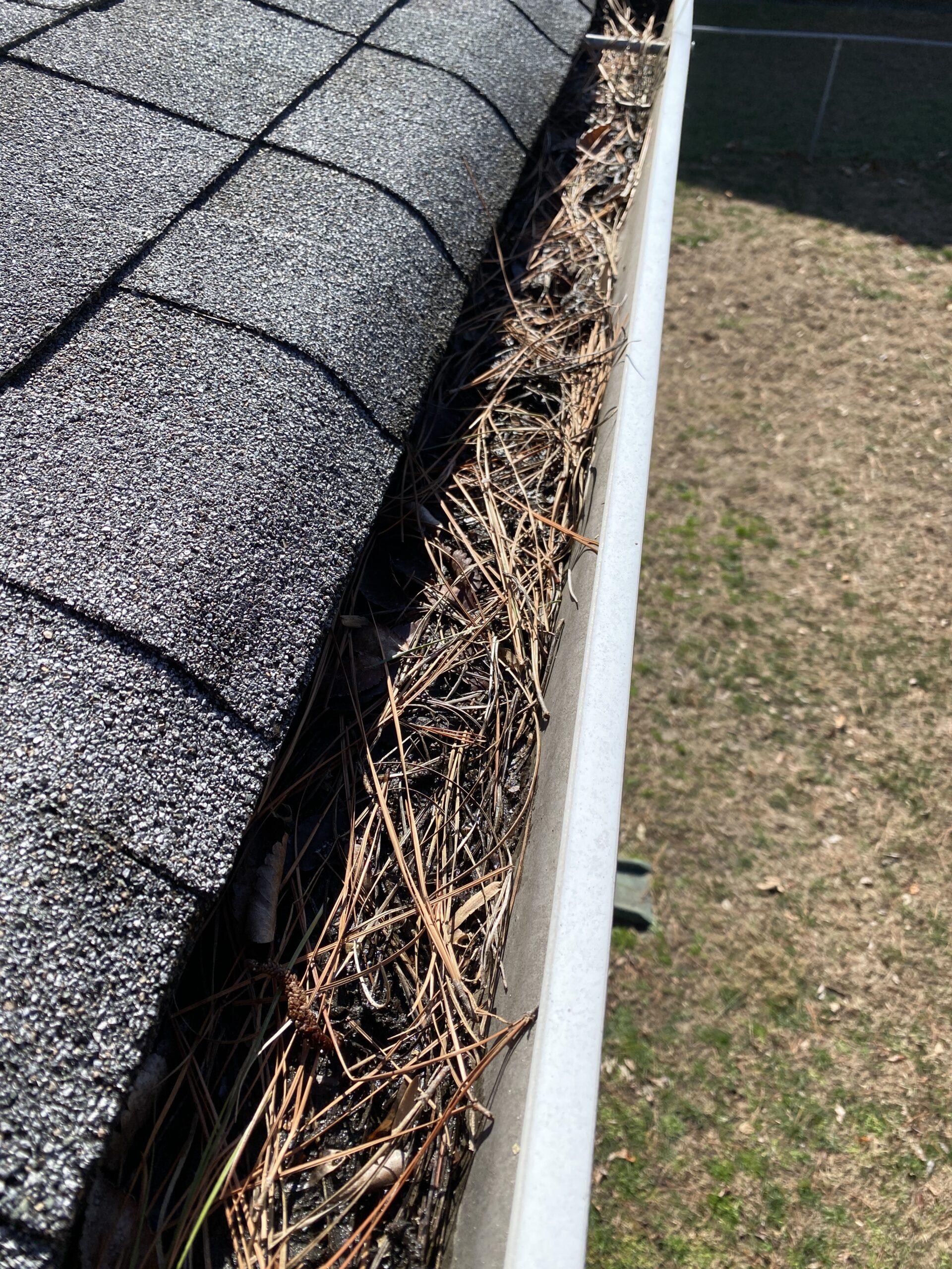 Dirty gutters before professional gutter cleaning in Yorktown VA